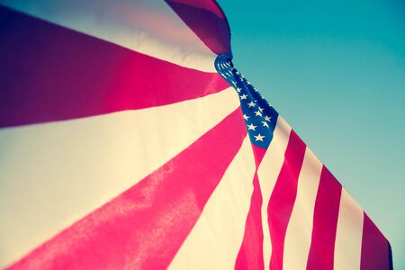 Happy Memorial Day Greeting, USA patriotic flag on blue sky and sunlight background with text Happy Memorial Day.の写真素材
