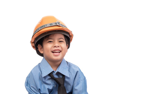 Little asian boy happy in construction engineering suit  on white background. Dream job concept. clipping path.の写真素材