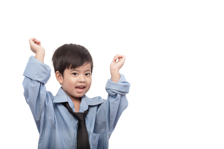 Little asian boy happy in business suit for businessman look on white background. Dream job concept. clipping path.の写真素材