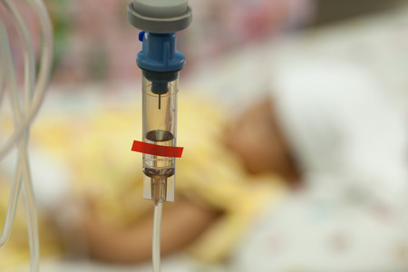 Close up saline IV drip for patient and Infusion pump in hospital, In the hospital with a fragment...