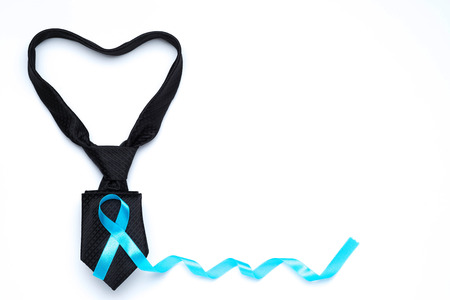 light blue awareness ribbon and black necktie heart shape for prostate cancer awareness campaign and men's health concept in November and September month.の写真素材