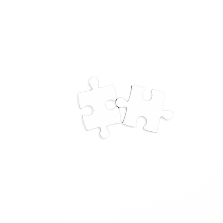 White jigsaw puzzle on white backgroundの写真素材