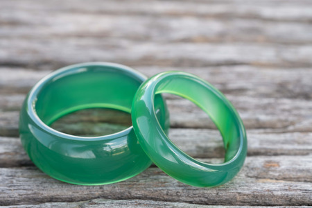 Jade ring on wooden, Concept of love.の写真素材