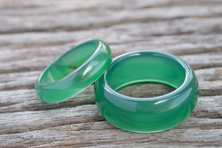 Jade ring on wooden, Concept of love.