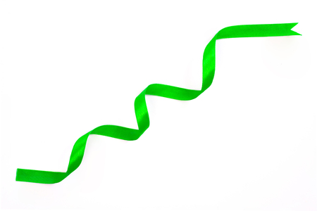 Beautiful green ribbon twist spiral isolated on white background.の写真素材