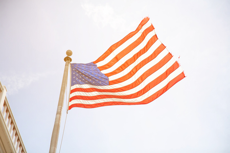 American flag with the sky is full of clouds in the rainy season. For Memorial Day or 4th of July.の写真素材