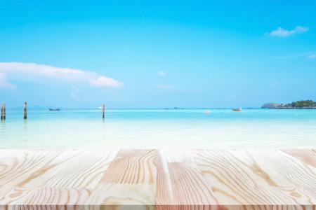 Perspective empty pine wooden table on top over blur background, can be used mock up for montage products display or design layout.の写真素材