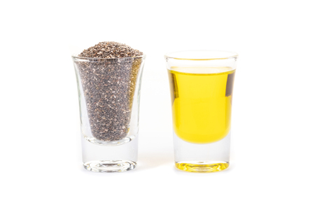 Chia seeds and chia oil on white background.Organic chia seed oil.Healthy food,superfood. Healthcare concept.の写真素材