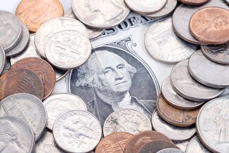 Money, US Dollars bank notes, penny, nickel, dime, quarter on a white background.の写真素材