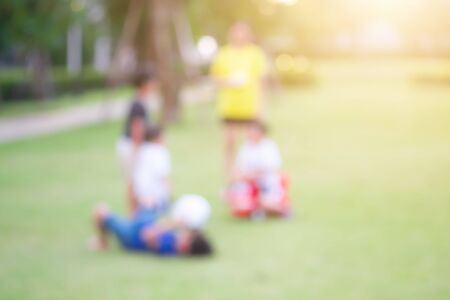 Asian boy playing with friends at the playground.の写真素材