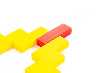 Abstract wooden block on white background. Symbol of leadership, teamwork and different. Business and design concept.の写真素材