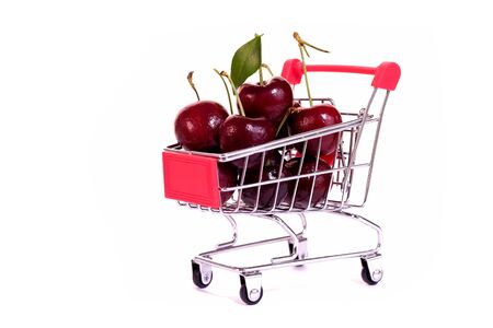 Texture of cherry in shopping cart isolated on white background. Sweet fresh cherry.の写真素材