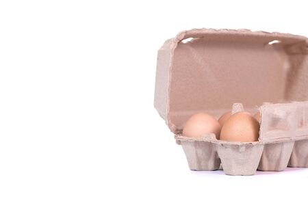 Brown paper egg box and egg isolated on white background.