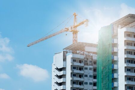 Crane and building construction and blue sky.