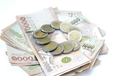 Thailand banknote and coin isolated on white background.の写真素材