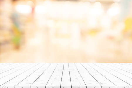 Perspective white wooden table on top over blur natural background, can be used mock up for montage products display or design layout.の写真素材