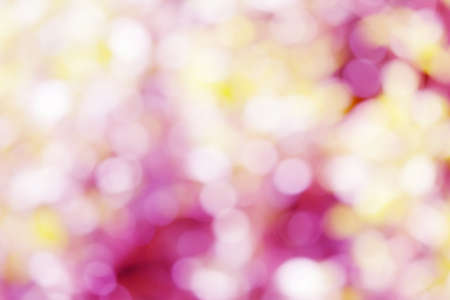 Abstract blur bokeh light pink and yellow soft pastel color wallpaper background.の写真素材