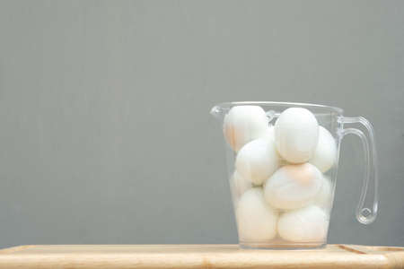 Boiled eggs. Boiled eggs in jar on wooden table.の写真素材