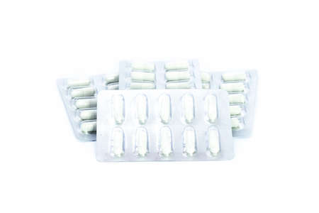 Blister pack and white capsule on white background. Close up of blister pack.