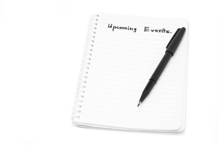 Concept Upcoming Events message on notebook with pen on white background.の写真素材