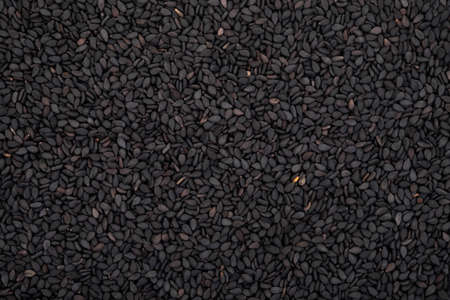 Black sesame seeds organic on white background. Health food concept.の写真素材