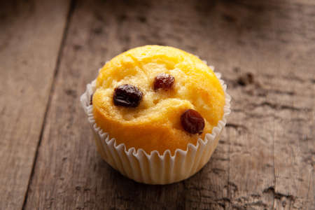 Cupcake currant on wooden table.の写真素材