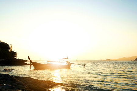 Long tail boat and beautiful sunset view. Concept holiday. Tropical paradise beach nature landscape at Lipe in Thailand.の写真素材