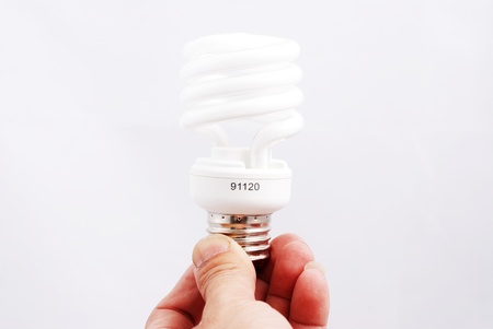 Light bulb in a hand isolated on white background