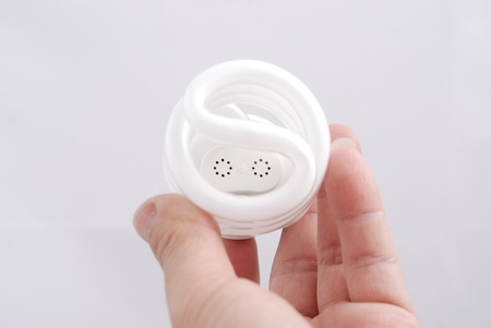 Light  in a hand isolated on white backgroundの写真素材