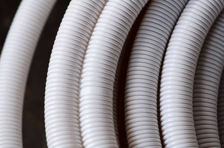 Corrugated White Pipes for posting background の写真素材