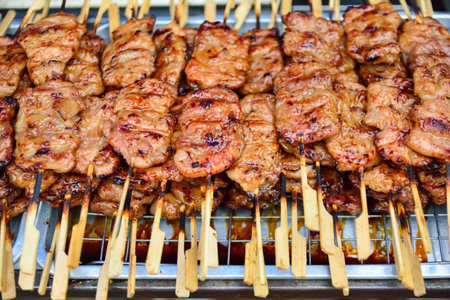 Skewers of pork on the street market in Thailand.の写真素材