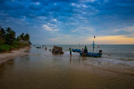 Fisherman fishing nets on the beach in morning.のeditorial素材