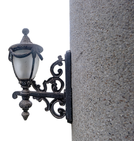 The old lamp on pole in the white background.の写真素材