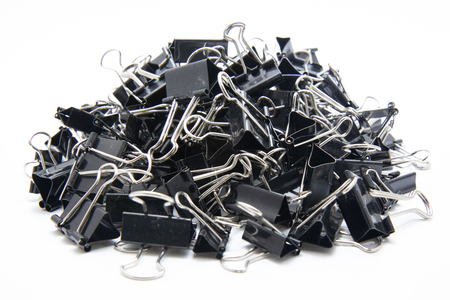 Black Paper clip isolated on white background.の写真素材