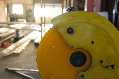 Close up blade of circular saw on blurred background