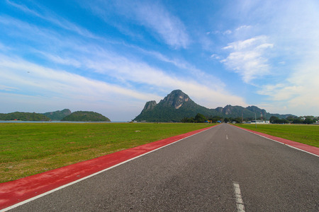 scenic upland country road overlooking wooded valley with grazing meadows nearの写真素材