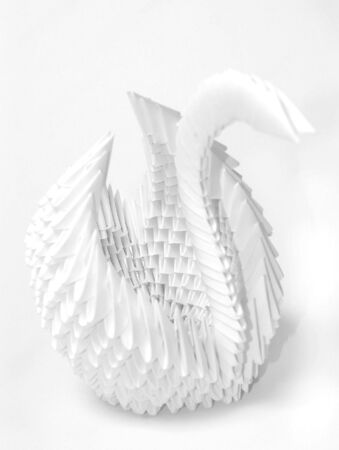White paper origami swan on white backgroundの写真素材