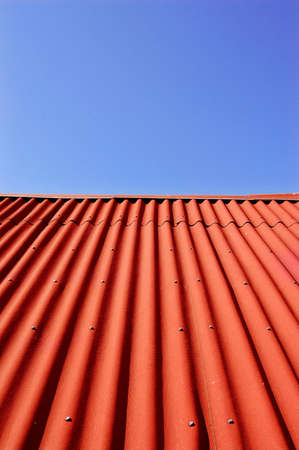 red roof top and blue skyの写真素材