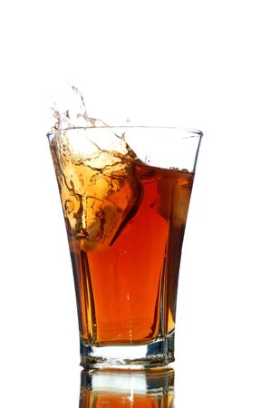 soft drink with a splash isolated on whiteの写真素材