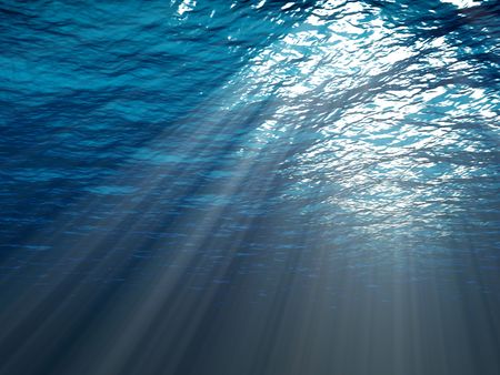 An underwater scene with sunrays shining through the waterの写真素材