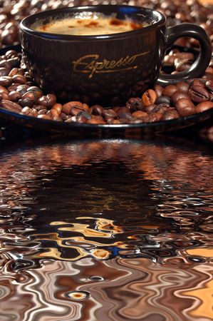 a cup of coffee and coffee beansの写真素材