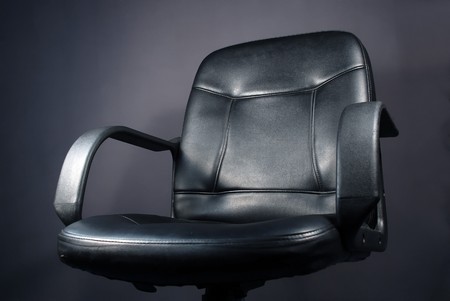 office chair on dark backgroundの写真素材