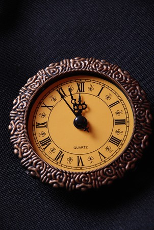 old clock showing time about twelve