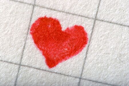 Heart on textured paper extreme close-up 