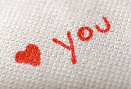 Heart on textured paper extreme close-up の写真素材