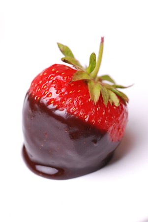Strawberry dipped in melting dark chocolateの写真素材