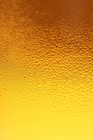 Fresh beer dewy glass texture close-upの写真素材