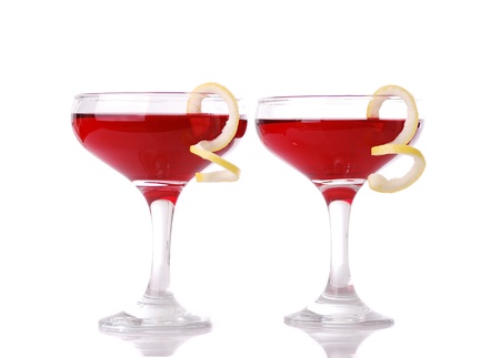 Photo of two Cosmopolitan cocktails with lemon garnishの写真素材