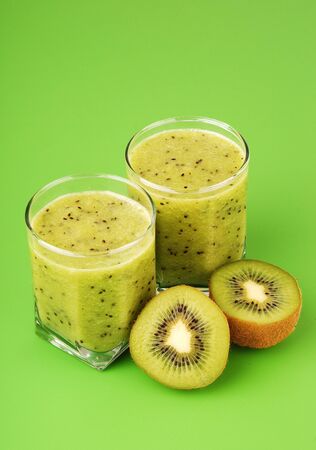 Kiwi smoothie on green backgroundの写真素材