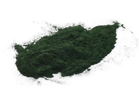 Spirulina powder isolated on whiteの写真素材